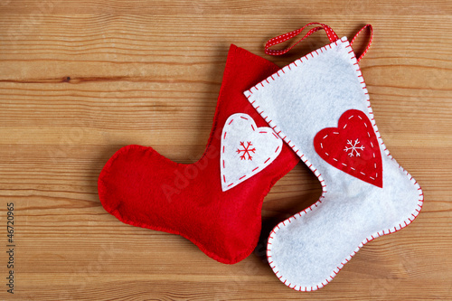 Photo: Christmas stockings on wooden background. Christmas stockings on wooden background.