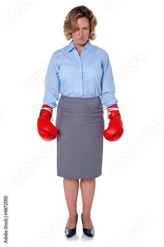 Photo: Businesswoman wearing boxing gloves Businesswoman wearing boxing gloves