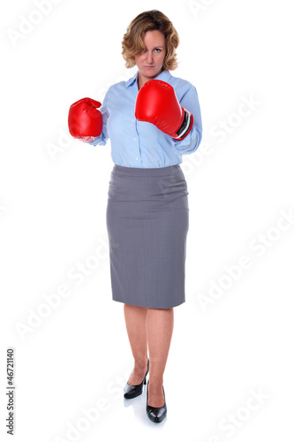 Photo: Businesswoman wearing boxing gloves Businesswoman wearing boxing gloves