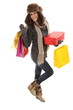 Woman in winter clothes with gifts and shopping bags smiling