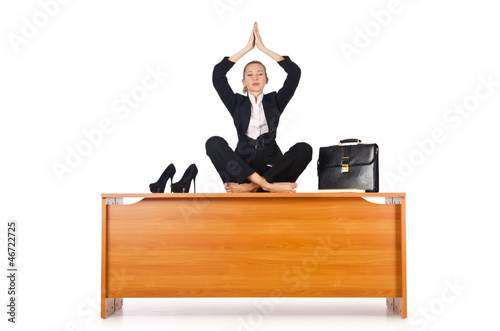 Photo: Businesswoman meditating isolated on white Businesswoman meditating isolated on white