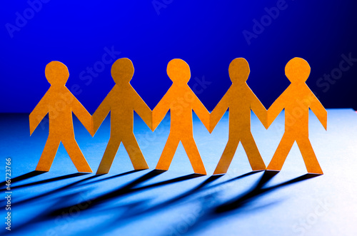 Photo: Paper people in teamworking concept Paper people in teamworking concept