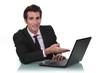 Businessman showing off his new laptop