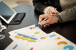 Human hand with business graphic