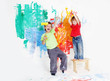 Photo: two young happy children - boy and girl - painting white wall two young happy children - boy and girl - painting white wall