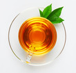 Photo: Cup with tea and green leaf Cup with tea and green leaf