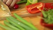 Dolly shot of female hands cutting onion spring in kitchen