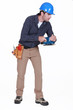 Tradesman holding a sander