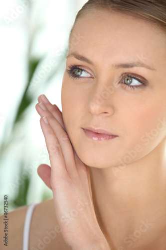 Photo: beautiful woman taking care of her skin beautiful woman taking care of her skin