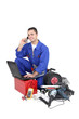 Electrician surrounded by equipment