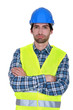 bored craftsman posing arms crossed