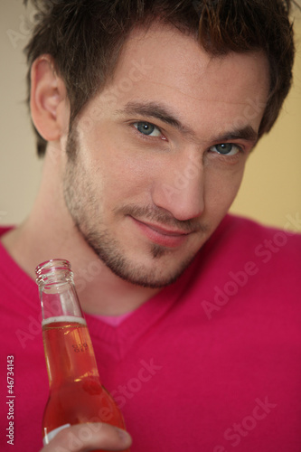 Photo: Man with bottle of beer Man with bottle of beer