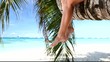 Woman sitting on palm