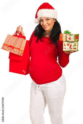 Photo: Pregnant woman with Christmas shoppings Pregnant woman with Christmas shoppings