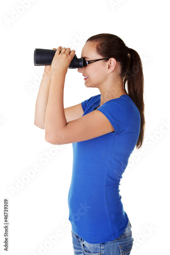 Photo: Attractive woman with binoculars Attractive woman with binoculars