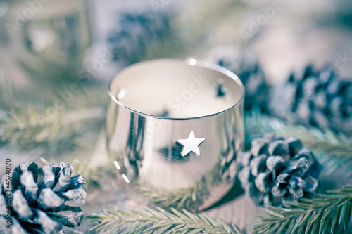 Photo: Christmas candle on a wooden background in vintage style Christmas candle on a wooden background in vintage style