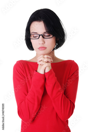 Photo: Portrait of a young caucasian woman praying Portrait of a young caucasian woman praying