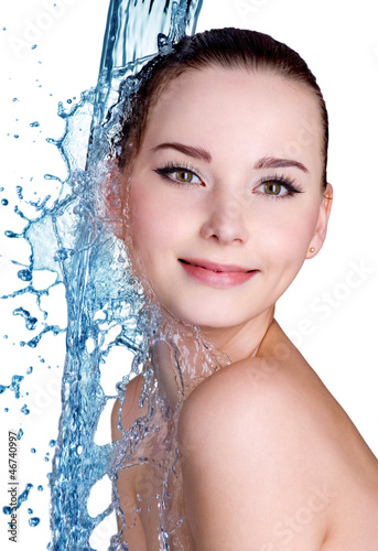 Photo: Smiling woman under stream of water Smiling woman under stream of water
