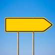 Illustration: Blank yellow road sign, direction pointer to right against blue Blank yellow road sign, direction pointer to right against blue