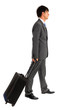 Young business man walking with his trolley bag