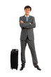 Full length of business man standing near luggage