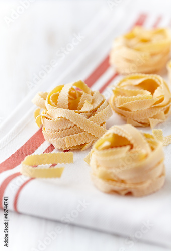 Photo: Italian egg pasta on kitchen towel Italian egg pasta on kitchen towel
