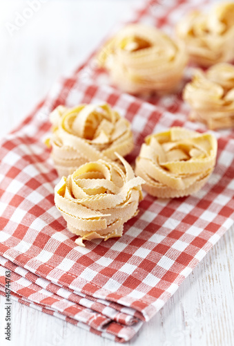 Photo: Italian egg pasta on kitchen towel Italian egg pasta on kitchen towel