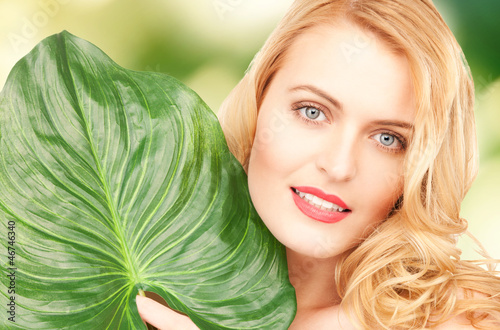 Photo: woman with green leaf woman with green leaf