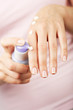 woman applying cream on hands