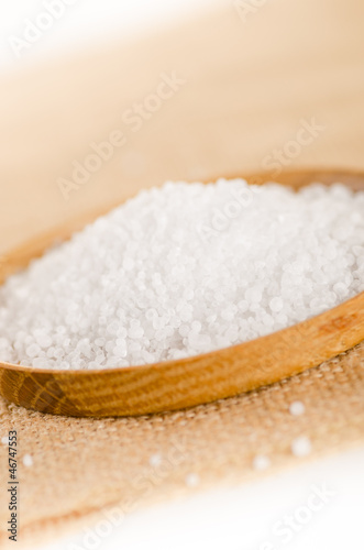 Photo: Sea salt in the wooden bowl with pepper corns on burlap sack on Sea salt in the wooden bowl with pepper corns on burlap sack on
