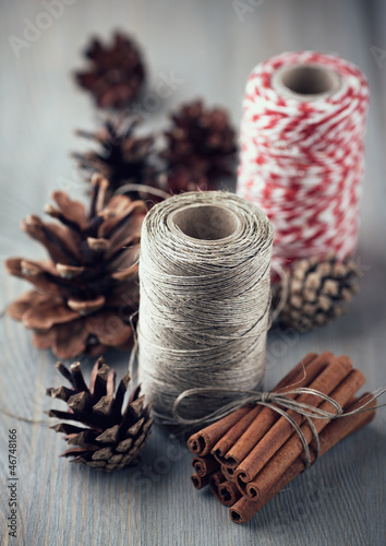 Photo: Cinnamon sticks, cones and kitchen string for christmas decor Cinnamon sticks, cones and kitchen string for christmas decor