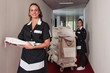 Photo: Two chambermaid women cleaning in a hotel. Two chambermaid women cleaning in a hotel.