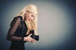 Photo: Beautiful blonde woman with medium format camera Beautiful blonde woman with medium format camera