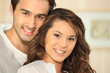 Photo: Young man smiling and Asian girl Young man smiling and Asian girl