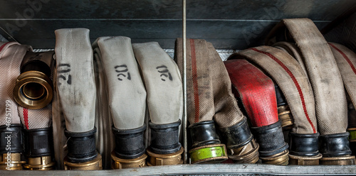 Photo: Old fire hoses placed in a compartment of the fire truck Old fire hoses placed in a compartment of the fire truck