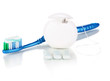 Toothbrush, chewing gum and dental floss isolated on white