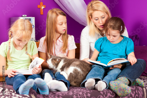 Photo: Mother is reading a book Mother is reading a book