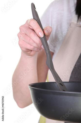 Photo: Close-up shot of a pan and spatula Close-up shot of a pan and spatula