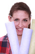 Woman holding selection of wallpaper
