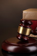 Gavel and books on law isolated on black close-up