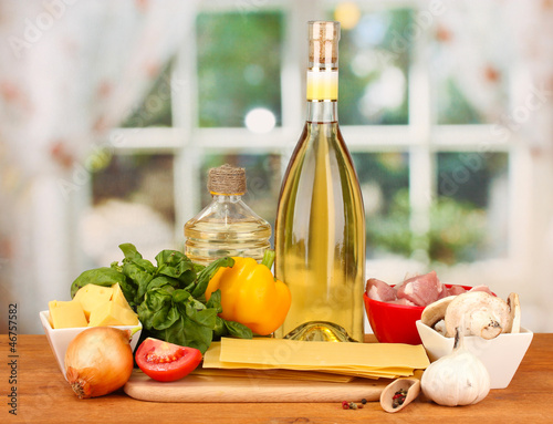 Photo: Lasagna ingredients on bright background Lasagna ingredients on bright background