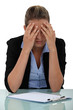 Stressed young office worker with clip board