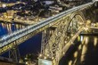 Dom Luis bridge over Douro river at night in Porto Portugal