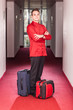 Bellboy with Luggages in the Hallway