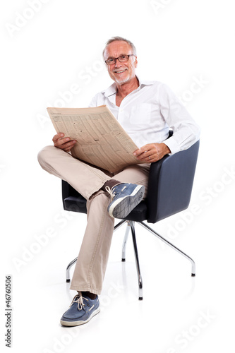 Photo: Casual senior man loking for stock rates Casual senior man loking for stock rates