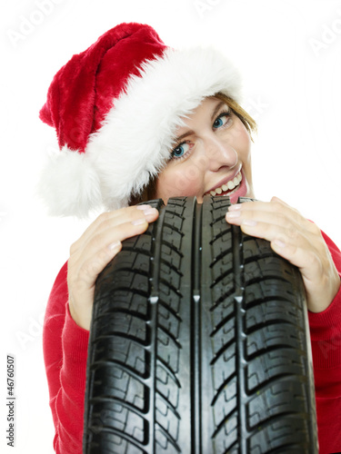 Photo: Miss santa leans against a tire waiting for christmas Miss santa leans against a tire waiting for christmas