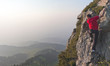 young man climbing to the top