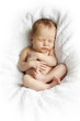 newborn baby sleeping on a white blanket
