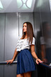 Young business woman in an elevator