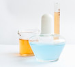 Tubes, bulb and measuring glass with colorful  liquids